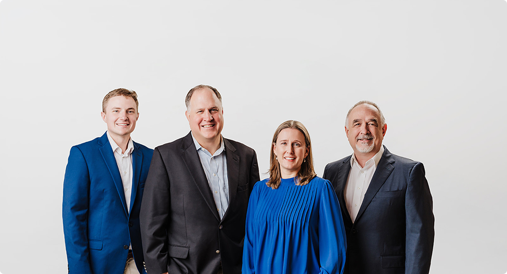 Campbell Asset Management's four-person team standing together against a plain white background.